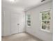 Bedroom with two windows for natural light and double door closet at 10836 Wilmore Dr, Raleigh, NC 27614