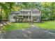 Attractive two-story home featuring covered porch, mature trees and landscaping at 10836 Wilmore Dr, Raleigh, NC 27614