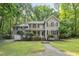 Charming two-story home with a cozy front porch and well-maintained landscaping at 10836 Wilmore Dr, Raleigh, NC 27614