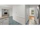 Bright kitchen featuring beautiful blue tile flooring and white cabinets at 10836 Wilmore Dr, Raleigh, NC 27614