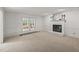 Spacious living room features fireplace and french doors to the backyard at 10836 Wilmore Dr, Raleigh, NC 27614