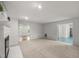Bright living room with a fireplace and views to the breakfast nook at 10836 Wilmore Dr, Raleigh, NC 27614