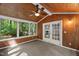 Charming sunroom with wood ceiling and wall paneling with an exterior exit at 10836 Wilmore Dr, Raleigh, NC 27614