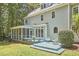 A lovely home has a deck overlooking a spacious backyard with mature trees at 110 Duckwood Ln, Cary, NC 27518