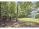A vast backyard provides wooded views, swing set and direct access to the screened porch at 110 Duckwood Ln, Cary, NC 27518