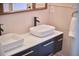 Modern bathroom with double sinks, black hardware, and stylish lighting at 110 Duckwood Ln, Cary, NC 27518