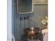 Close-up of a modern bathroom's vessel sink with sleek fixtures and wainscoting detail at 110 Duckwood Ln, Cary, NC 27518