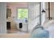 View through open door to bathroom with freestanding tub and modern fixtures at 110 Duckwood Ln, Cary, NC 27518
