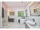 Bright bathroom with double vanities, freestanding tub, and natural light at 110 Duckwood Ln, Cary, NC 27518