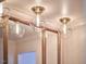 Stylish bathroom lighting reflected in the mirror with round glass light fixtures at 110 Duckwood Ln, Cary, NC 27518