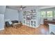 Finished bonus room provides a recreational area with shelving, games, and a piano at 110 Duckwood Ln, Cary, NC 27518