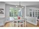 Cozy breakfast nook with large windows, wood floors and table with seating for four at 110 Duckwood Ln, Cary, NC 27518