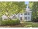 Traditional home with lush landscaping, and a charming front yard tree at 110 Duckwood Ln, Cary, NC 27518