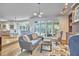 Open-concept living area with hardwood floors and access to outdoor space, ideal for entertaining at 110 Duckwood Ln, Cary, NC 27518