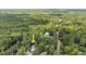 An aerial shot of a home shows its location near a pool, tennis court, and a quiet neighborhood at 12 Gatesway Ct, Durham, NC 27707