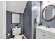 Charming half bathroom features blue walls, and a modern sink and fixtures at 12 Gatesway Ct, Durham, NC 27707
