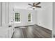 Bright bedroom with hardwood floors, ceiling fan, and natural light at 12 Gatesway Ct, Durham, NC 27707