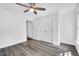 Bedroom featuring hardwood floors, ceiling fan, and spacious closet at 12 Gatesway Ct, Durham, NC 27707