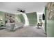 Spacious primary bedroom with en suite bathroom, a ceiling fan, and two large windows at 12 Gatesway Ct, Durham, NC 27707