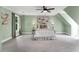 Large bedroom with large windows, decorative lighting and artwork and light-green walls at 12 Gatesway Ct, Durham, NC 27707