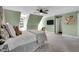Spacious bedroom featuring a ceiling fan and an en suite bathroom at 12 Gatesway Ct, Durham, NC 27707