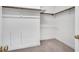 View of an empty walk-in closet with shelves and rods for storage and organization at 12 Gatesway Ct, Durham, NC 27707