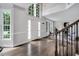 The foyer has hardwood floors, natural light from the large window, and the staircase is on the right at 12 Gatesway Ct, Durham, NC 27707