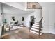 Spacious foyer featuring hardwood floors, a staircase, and elegant decor at 12 Gatesway Ct, Durham, NC 27707