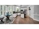Well-appointed kitchen featuring white cabinets, black countertops, and stainless steel appliances at 12 Gatesway Ct, Durham, NC 27707