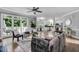 Bright living space with large windows, deck access, and seamless flow to the adjacent kitchen at 12 Gatesway Ct, Durham, NC 27707