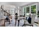 An open floor plan with a staircase, dining room, office, and a large window at 12 Gatesway Ct, Durham, NC 27707