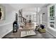An open floor plan with a staircase, dining room, office, and a large window at 12 Gatesway Ct, Durham, NC 27707