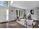 The light-filled office features neutral walls, large windows, and hardwood floors at 12 Gatesway Ct, Durham, NC 27707