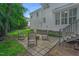Backyard patio area with a fire pit and seating, ideal for relaxing outdoors at 12 Gatesway Ct, Durham, NC 27707