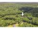 Lush, forested neighborhood aerial shot highlighting a tranquil and private setting at 126 Captains Ct, Durham, NC 27712