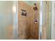 Walk-in shower featuring tile surround and upgraded shower head at 126 Captains Ct, Durham, NC 27712