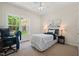 Bright bedroom with a large window view, complemented by neutral tones and a ceiling fan at 126 Captains Ct, Durham, NC 27712