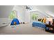Bright bedroom with large windows and playful decor, including a tent and blue bedding at 126 Captains Ct, Durham, NC 27712