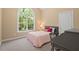 Cozy bedroom with large windows and a comfortable atmosphere at 126 Captains Ct, Durham, NC 27712