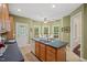 Bright eat-in kitchen featuring stainless appliances and an island with seating at 126 Captains Ct, Durham, NC 27712