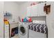 Convenient laundry room equipped with washer, dryer, sink and storage at 126 Captains Ct, Durham, NC 27712