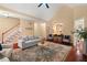 A neutral living room with hardwood floors, fireplace, and staircase presents an open and welcoming atmosphere at 126 Captains Ct, Durham, NC 27712
