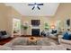 Bright living room with hardwood floors and fireplace as a central focal point creates inviting gathering space at 126 Captains Ct, Durham, NC 27712
