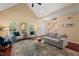 Inviting living room with hardwood floors, neutral decor, and adjacent staircase offers a cozy retreat at 126 Captains Ct, Durham, NC 27712