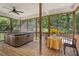 Screened-in porch with a hot tub at 126 Captains Ct, Durham, NC 27712