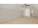 Cozy bedroom with neutral carpet, ceiling fan, and a white door at 127 Strike Eagle Dr, Broadway, NC 27505