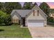 Charming single-Gathering home with a well-manicured lawn, two-car garage, and attractive exterior in a lovely neighborhood at 127 Strike Eagle Dr, Broadway, NC 27505