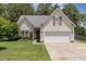 Charming single-Gathering home with a well-manicured lawn, two-car garage, and attractive exterior in a lovely neighborhood at 127 Strike Eagle Dr, Broadway, NC 27505