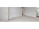 Open bedroom featuring carpeted floors, neutral walls, and doorways to other rooms at 134 Rusling Leaf Dr, Fuquay Varina, NC 27526