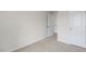 Bright room with soft carpet flooring, white trim, and multiple doorways at 134 Rusling Leaf Dr, Fuquay Varina, NC 27526